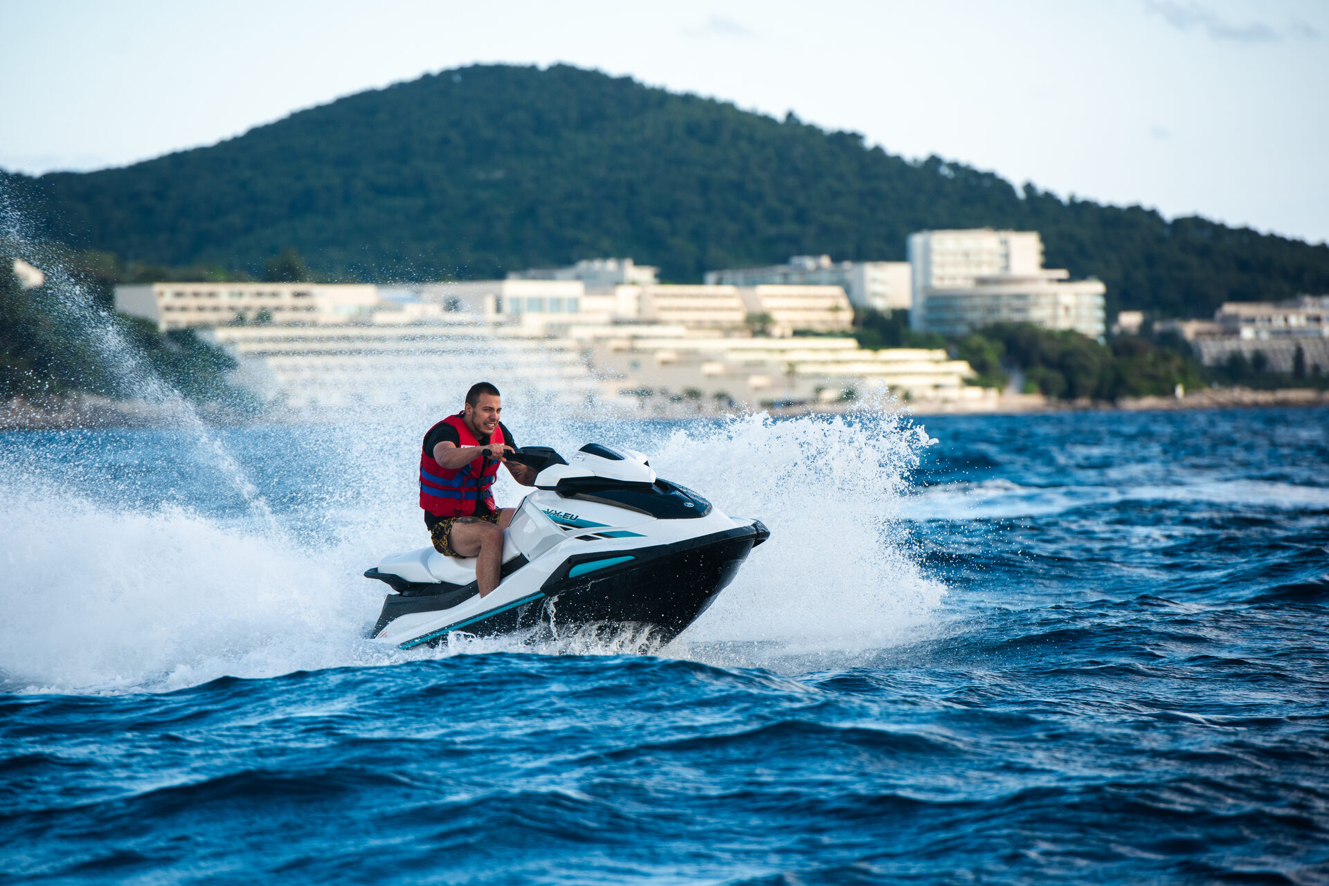 Jet ski speeding through crystal Adriatic waters near Dubrovnik Croatia