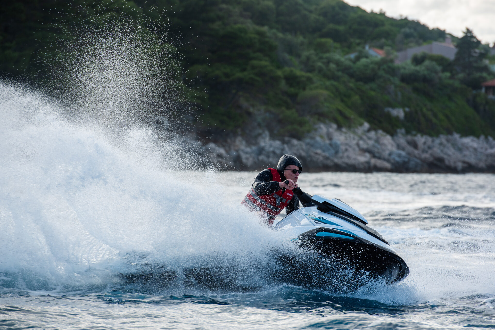 Jet ski near dramatic sea caves on the Dalmatian coast south of Dubrovnik